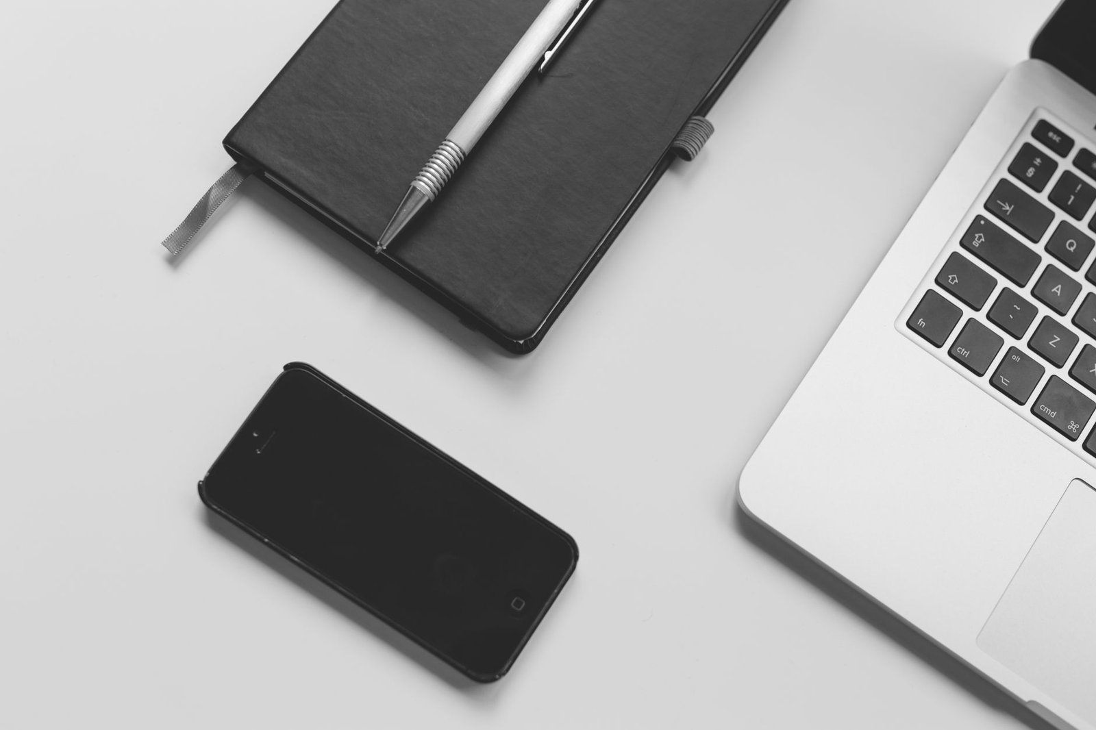 Open notebook and pen on a desk