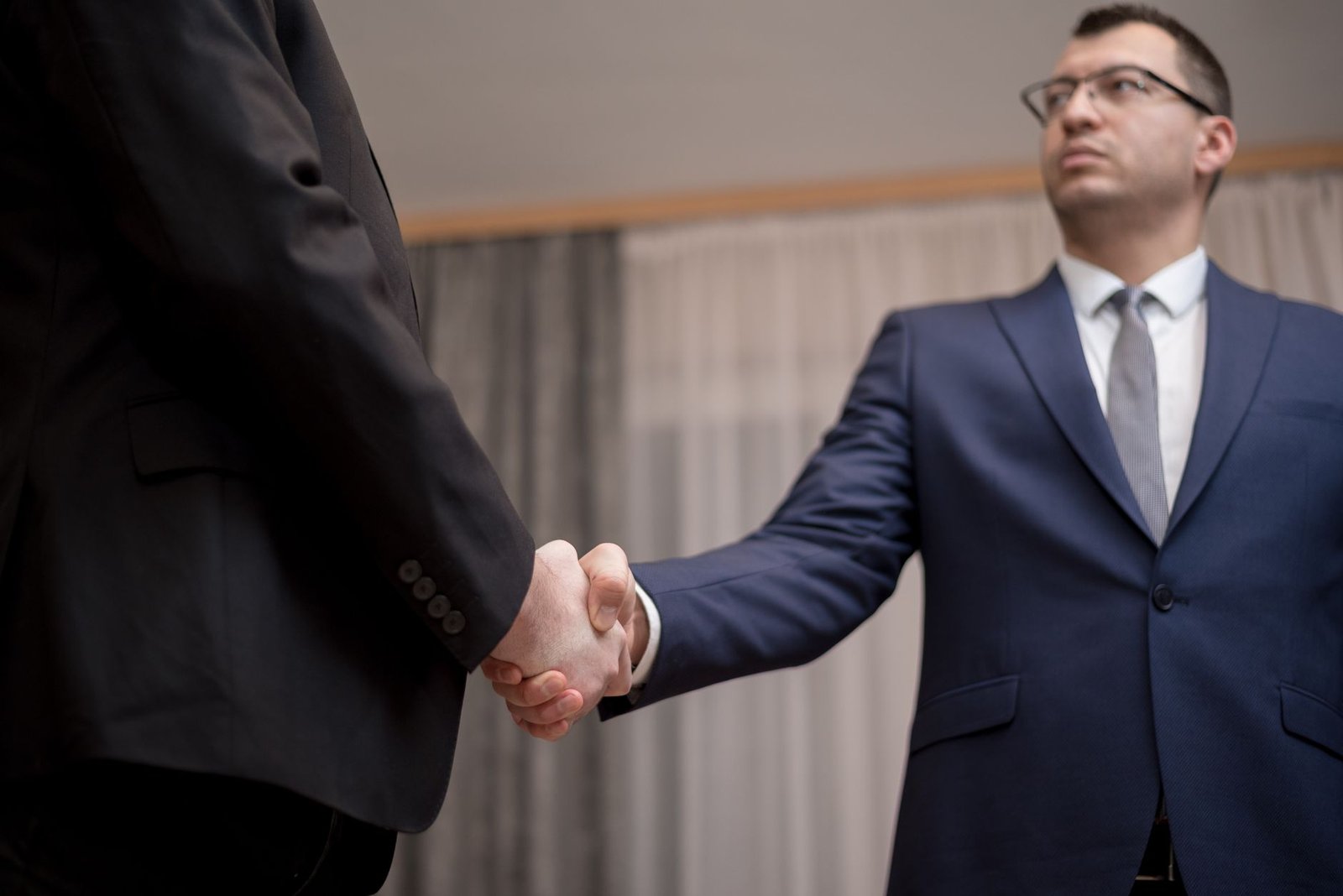 Close-up of a handshake representing a partnership