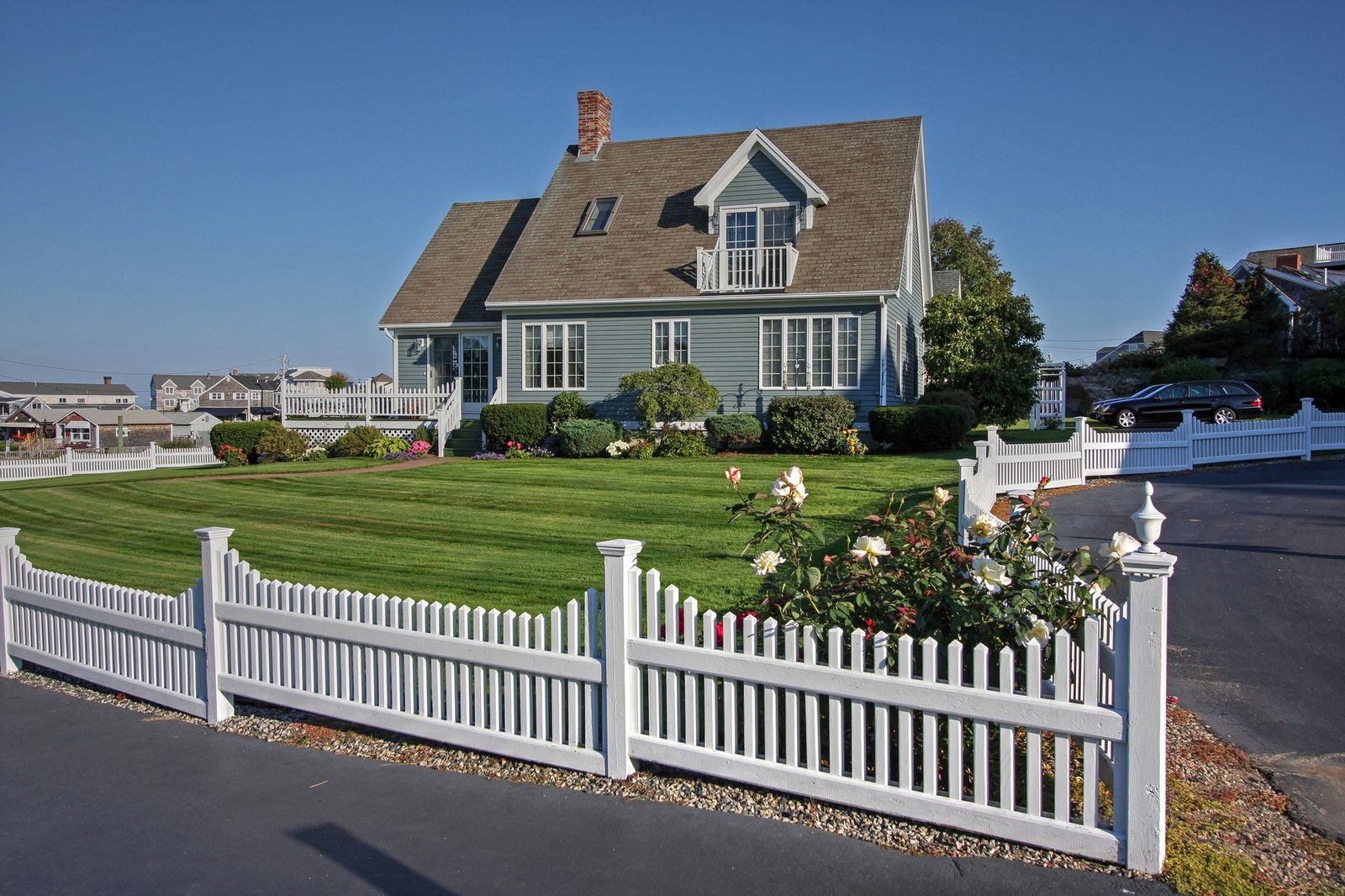 New England home with a white picket fence